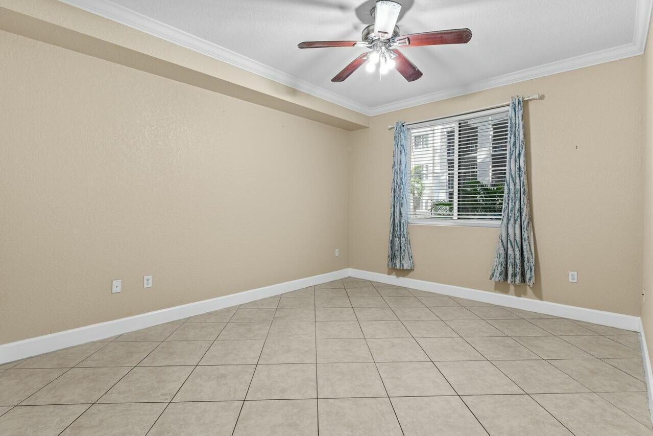 1690 Renaissance Commons Boulevard, Unit 1125 Boynton Beach, FL 33426 - Photo 13 of 37 a view of an empty room with a window