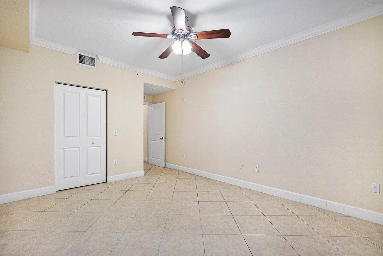 1690 Renaissance Commons Boulevard, Unit 1125 Boynton Beach, FL 33426 - Photo 19 of 37 wooden floor in an empty room