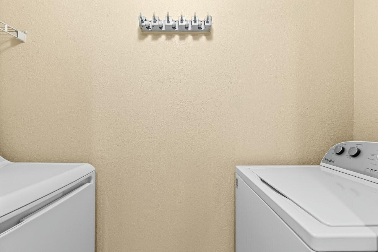 1690 Renaissance Commons Boulevard, Unit 1125 Boynton Beach, FL 33426 - Photo 20 of 37 a utility room with dryer and washer