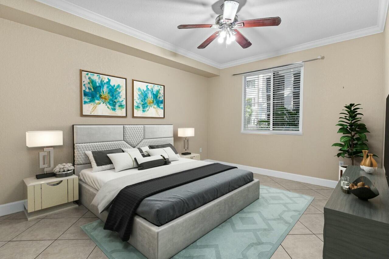 1690 Renaissance Commons Boulevard, Unit 1125 Boynton Beach, FL 33426 - Photo 2 of 37 a bedroom with a bed and a chandelier