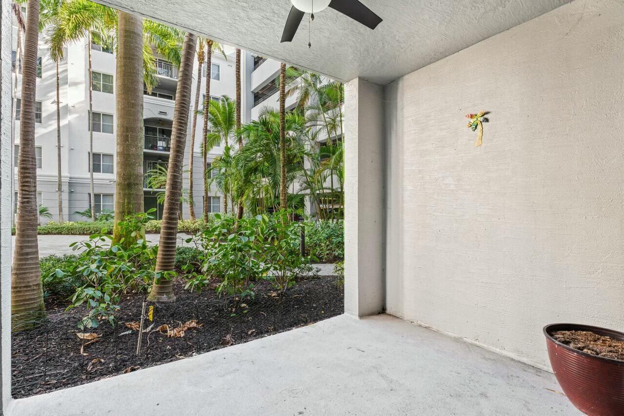 1690 Renaissance Commons Boulevard, Unit 1125 Boynton Beach, FL 33426 - Photo 21 of 37 a view of a potted plants in front of a building