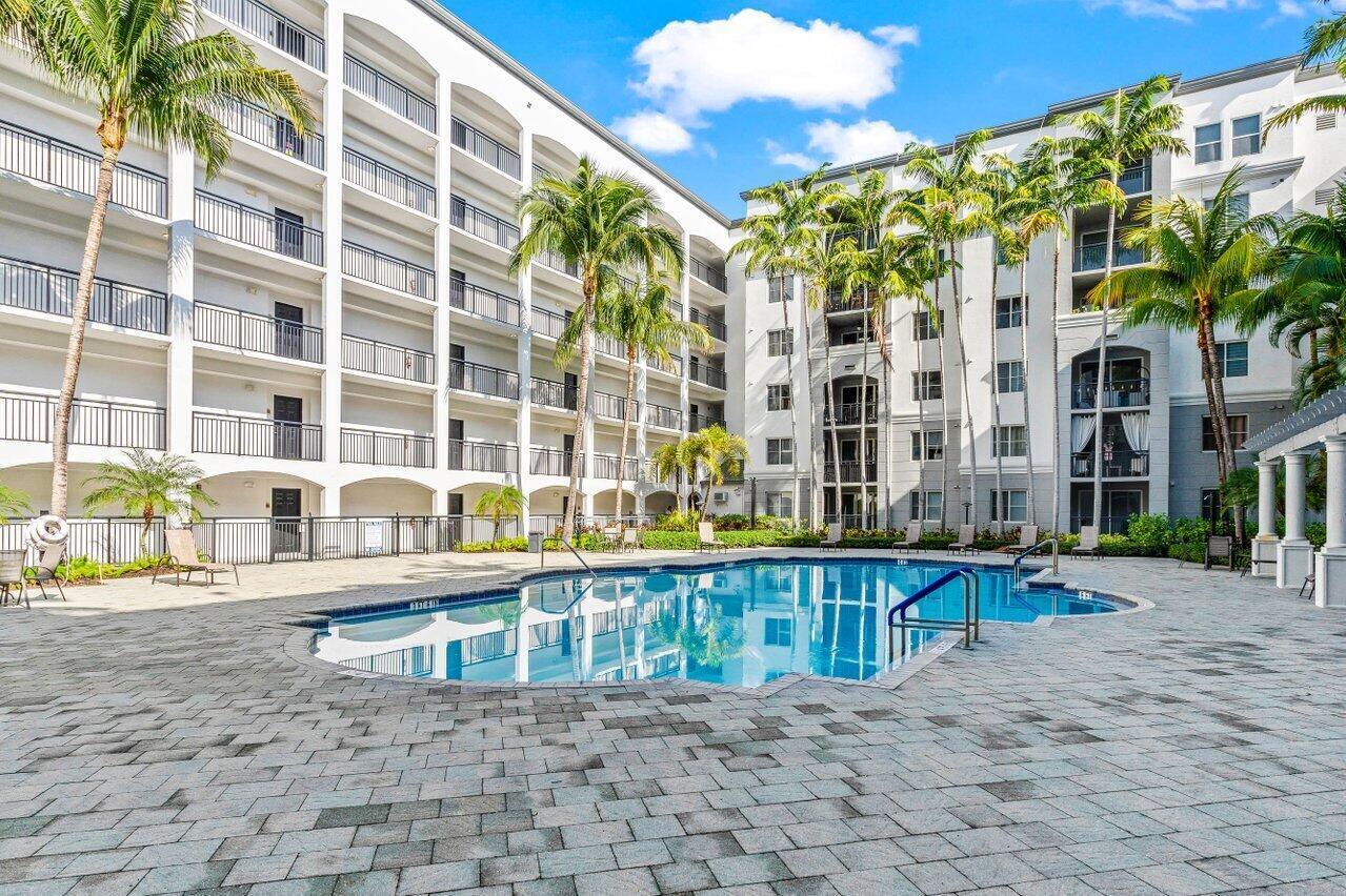 1690 Renaissance Commons Boulevard, Unit 1125 Boynton Beach, FL 33426 - Photo 26 of 37 a view of a building with a outdoor space