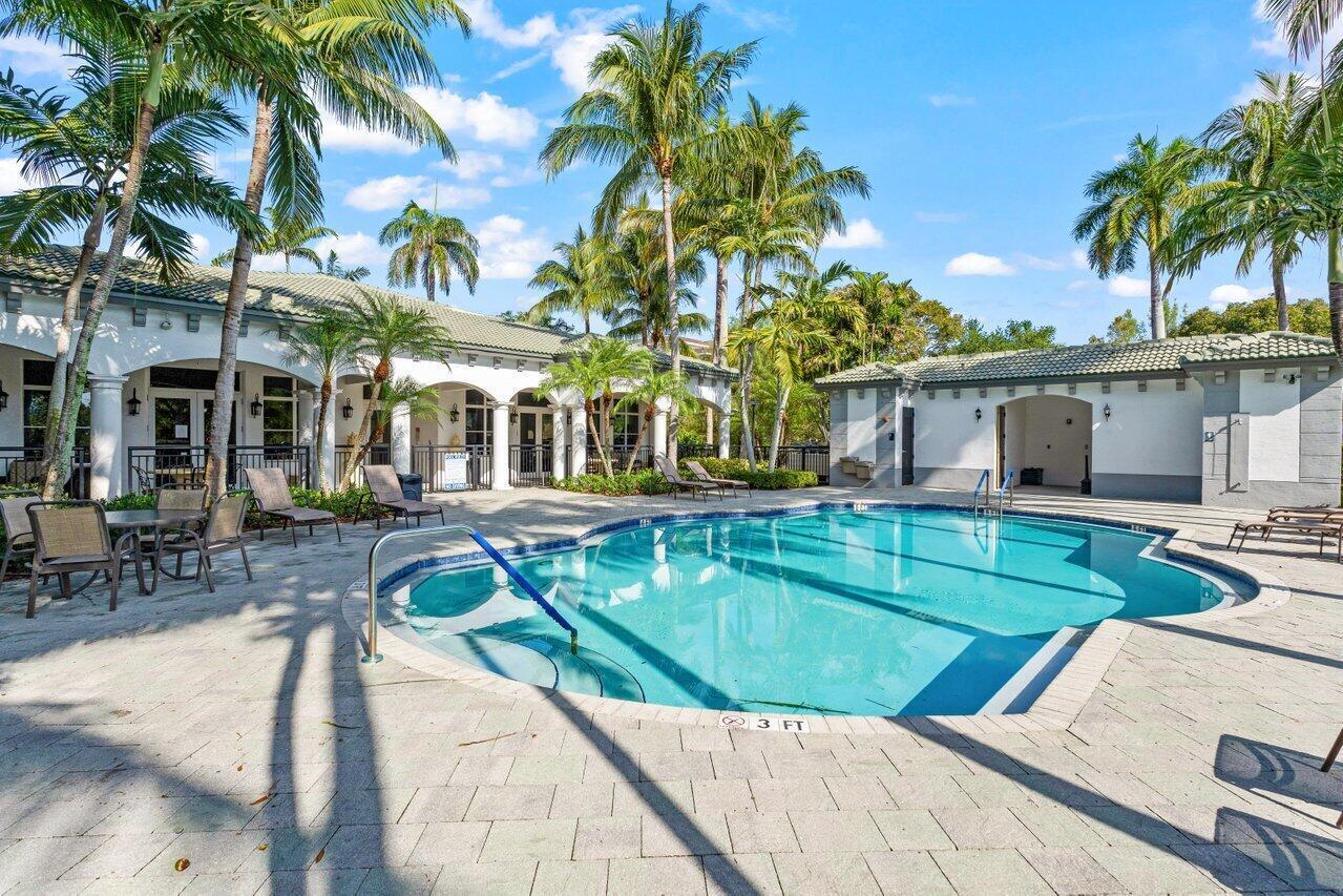 1690 Renaissance Commons Boulevard, Unit 1125 Boynton Beach, FL 33426 - Photo 27 of 37 a view of a house with swimming pool