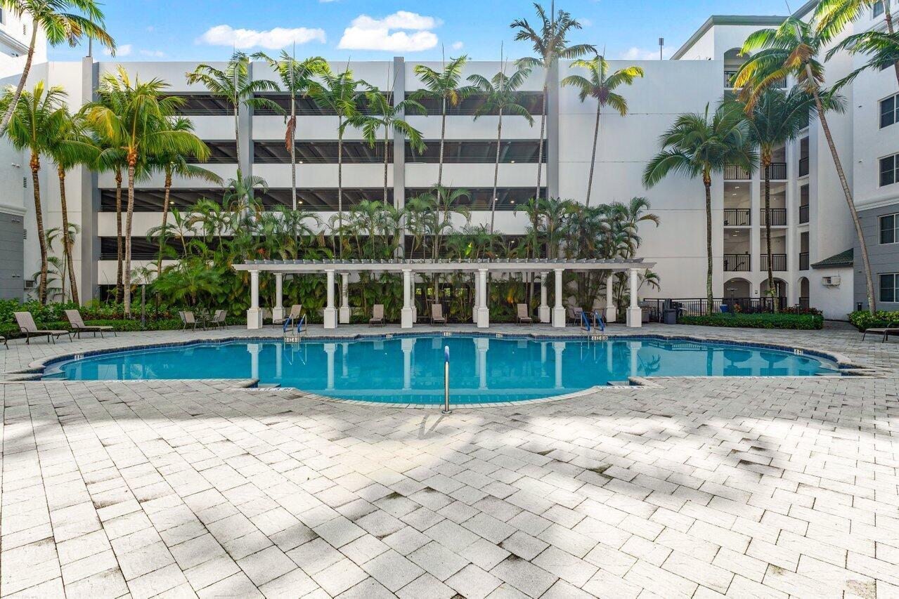 1690 Renaissance Commons Boulevard, Unit 1125 Boynton Beach, FL 33426 - Photo 29 of 37 a view of swimming pool with a yard