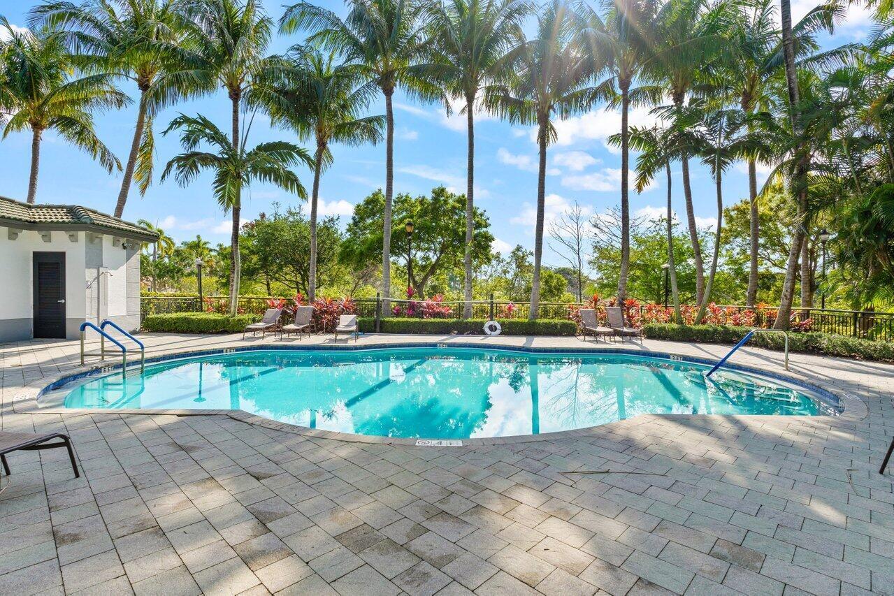 1690 Renaissance Commons Boulevard, Unit 1125 Boynton Beach, FL 33426 - Photo 30 of 37 a view of swimming pool with chairs