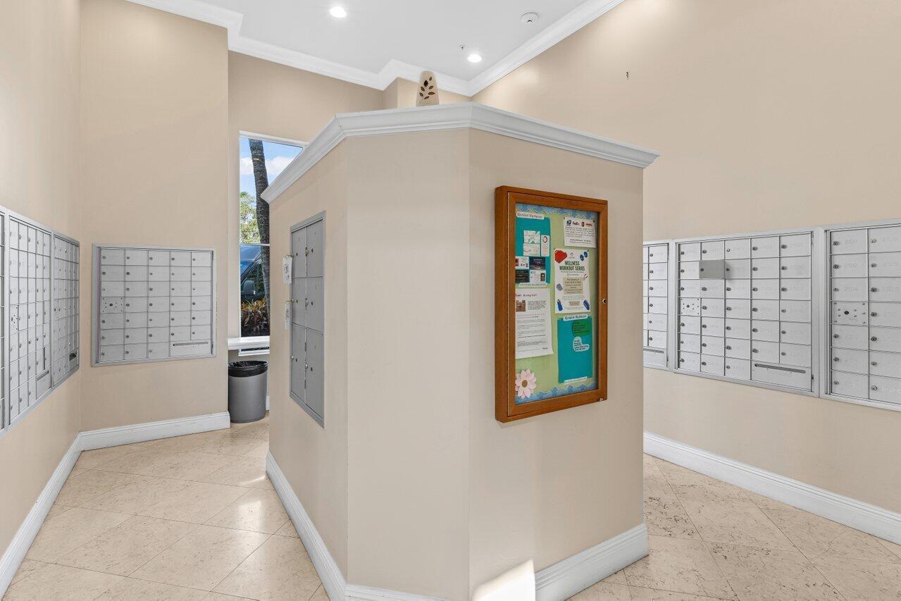 1690 Renaissance Commons Boulevard, Unit 1125 Boynton Beach, FL 33426 - Photo 32 of 37 a view of an entryway with wooden floor and windows