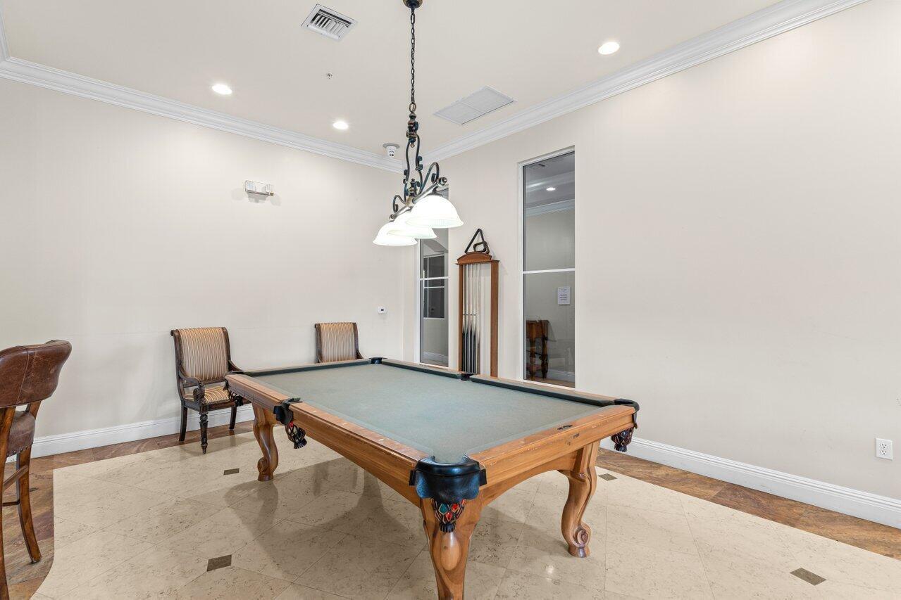 1690 Renaissance Commons Boulevard, Unit 1125 Boynton Beach, FL 33426 - Photo 35 of 37 a dining room with furniture and window