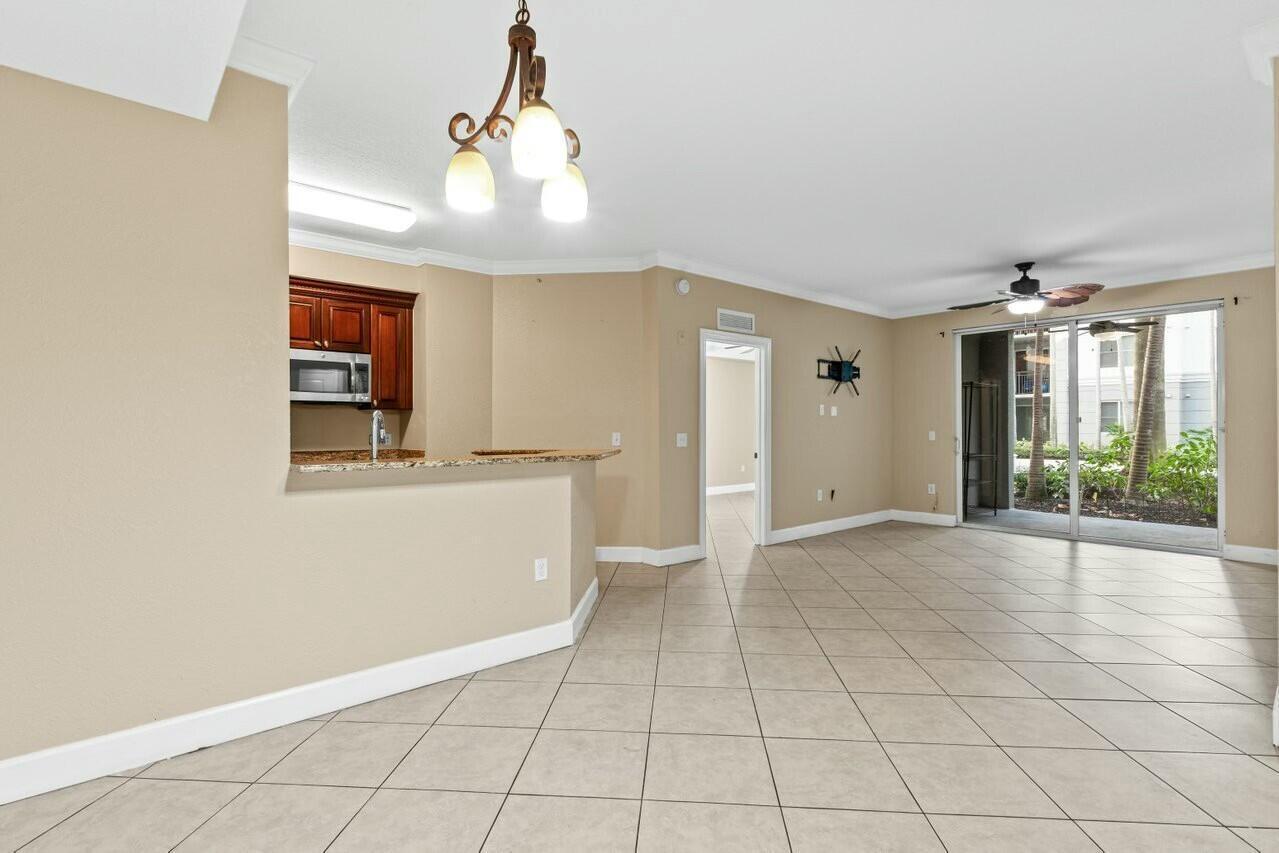 1690 Renaissance Commons Boulevard, Unit 1125 Boynton Beach, FL 33426 - Photo 8 of 37 a view of an empty room and window