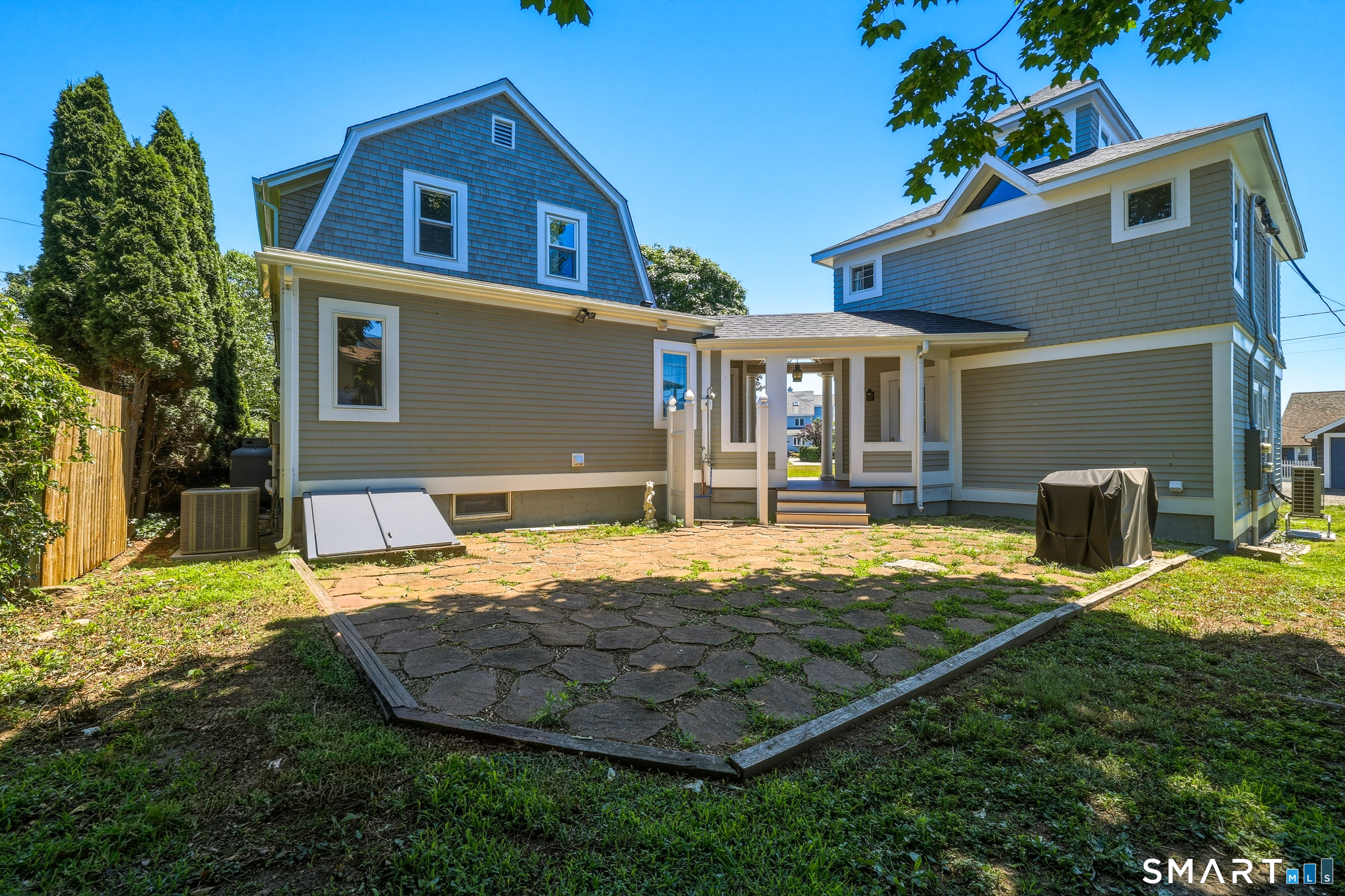 31 Sols Point Road Clinton, CT 06413 - Photo 25 of 40 Trex deck to patio outdoor with an outdoor shower for rinsing off after kayaking, paddle-boarding, boating, or a day at the beach.
