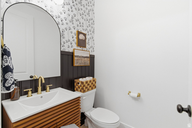 596 South Meade Street Mapleton, UT 84664 - Photo 8 of 38 Half bathroom featuring vanity, a wainscoted wall, and wallpapered walls
