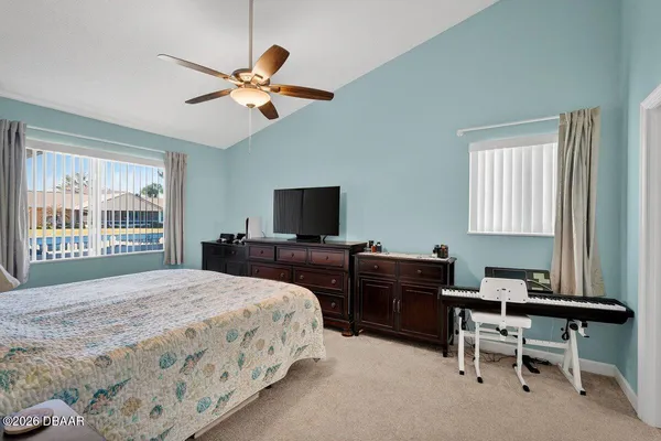 a bedroom with a bed and a desk