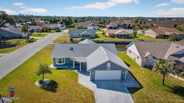 an aerial view of a house with swimming pool