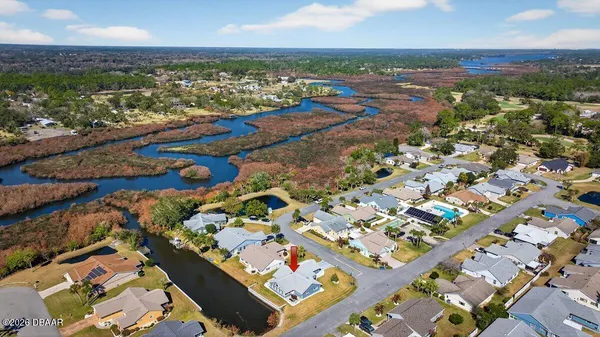 an aerial view of a city with ocean view