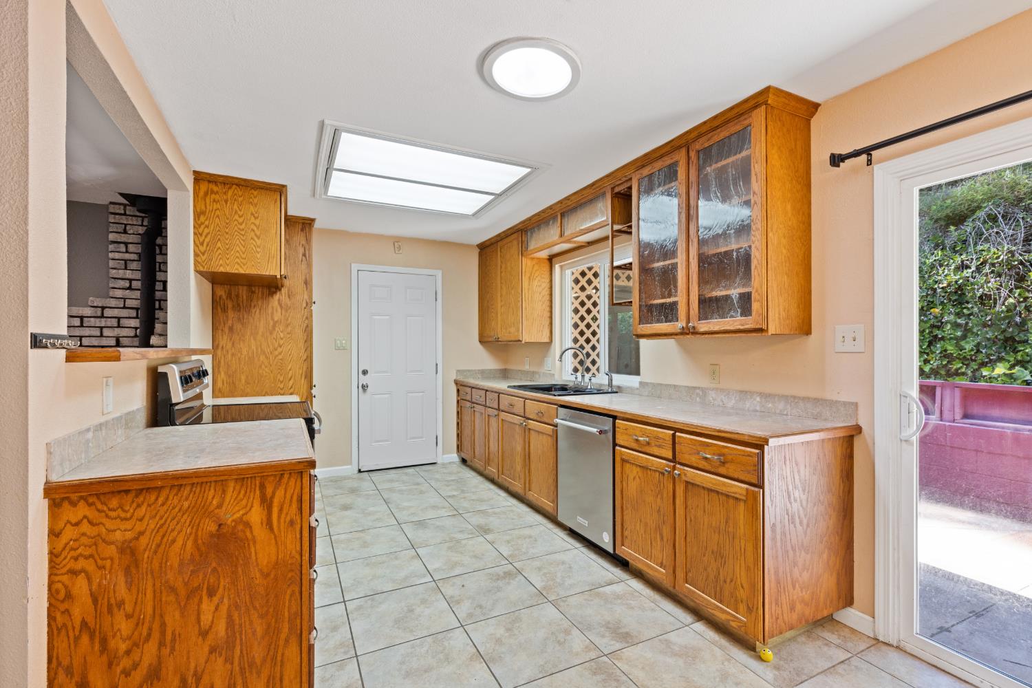 2971 Letitia Avenue Placerville, CA 95667 - Photo 60 of 65 a kitchen with stainless steel appliances granite countertop a sink and a refrigerator