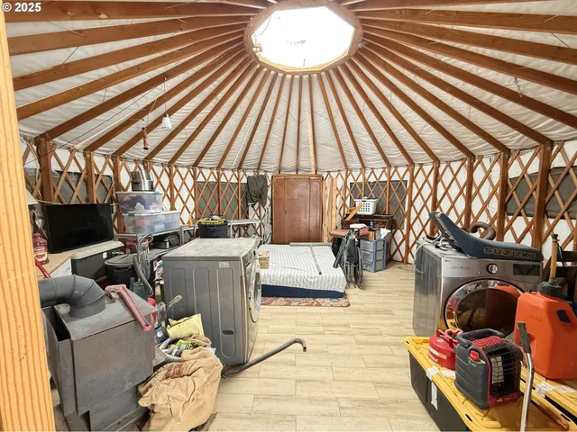 a view of a patio with table and chairs with wooden floor