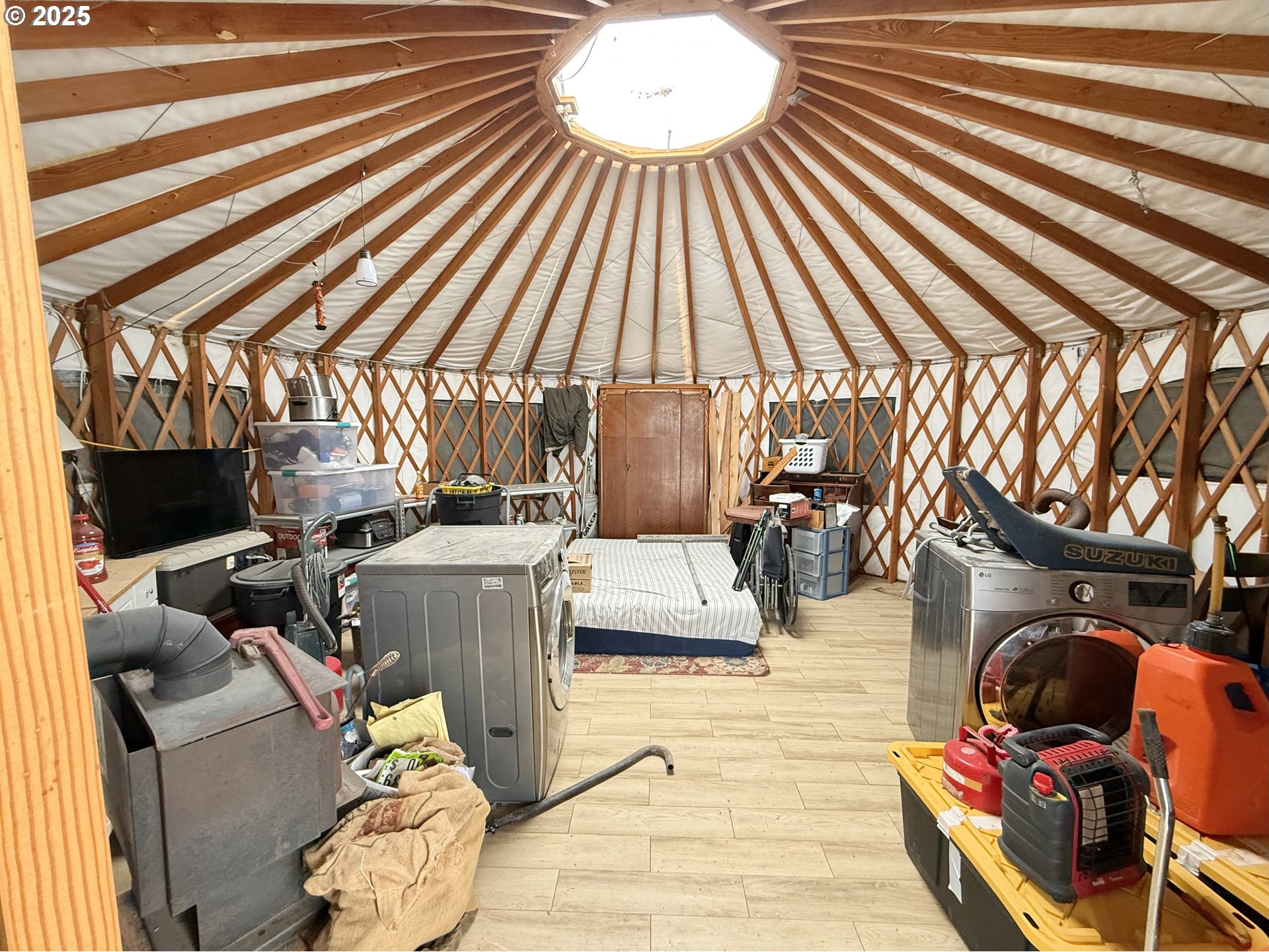 49927 Shuffield Road Summer Lake, OR 97640 - Photo 8 of 16 a view of a patio with table and chairs with wooden floor