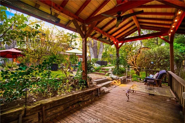 a view of a brick house with a chairs in patio