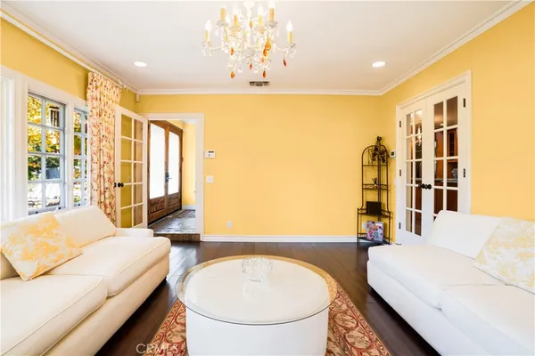 a spacious bedroom with a bed a table and chair