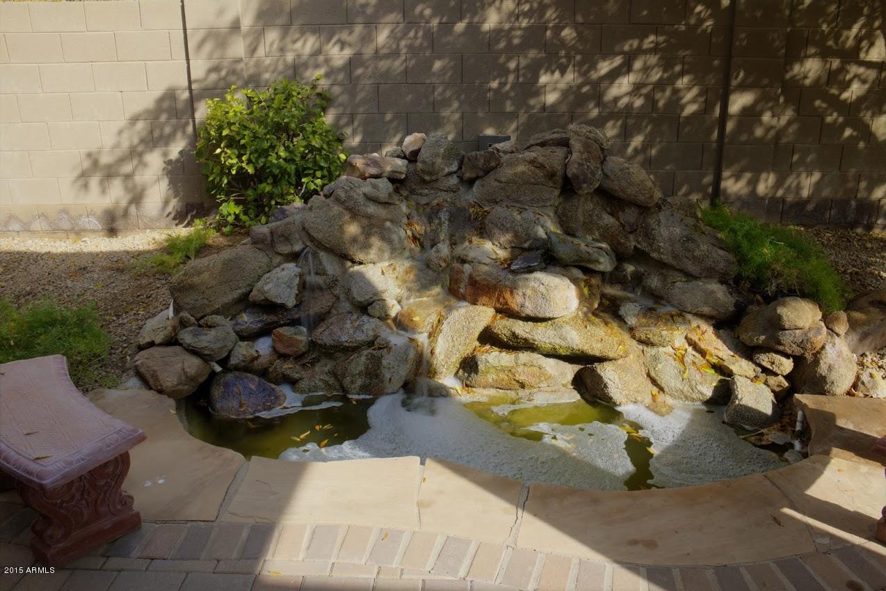2123 North Pacey Road Phoenix, AZ 85037 - Photo 38 of 38 Backyard Waterfall