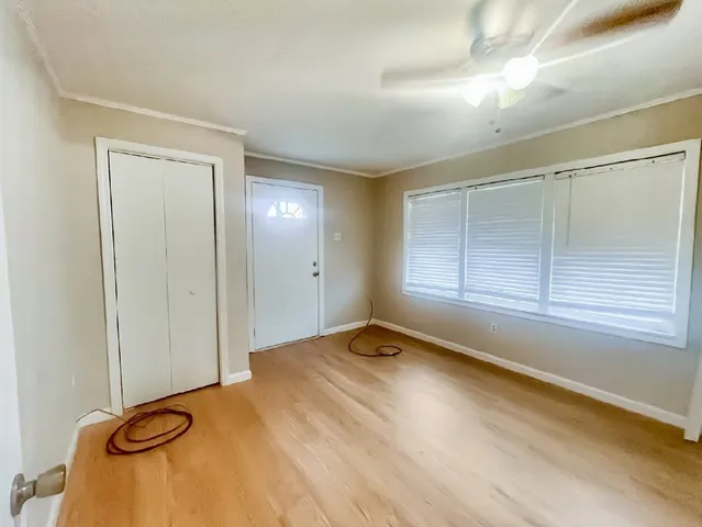 a view of an empty room with a window