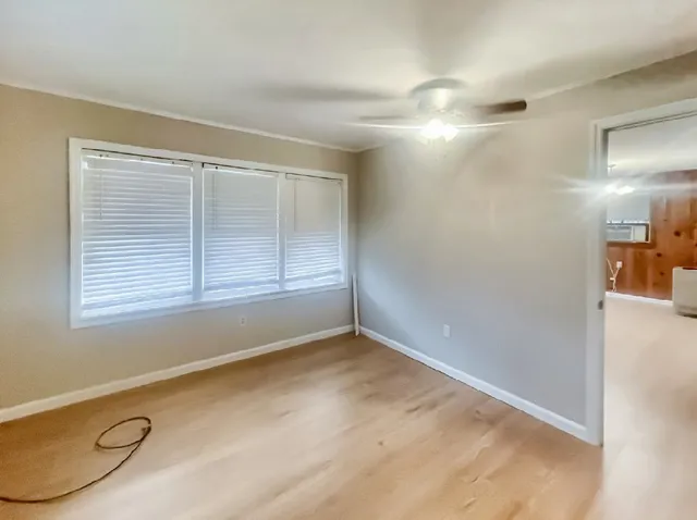 an empty room with a empty space and windows