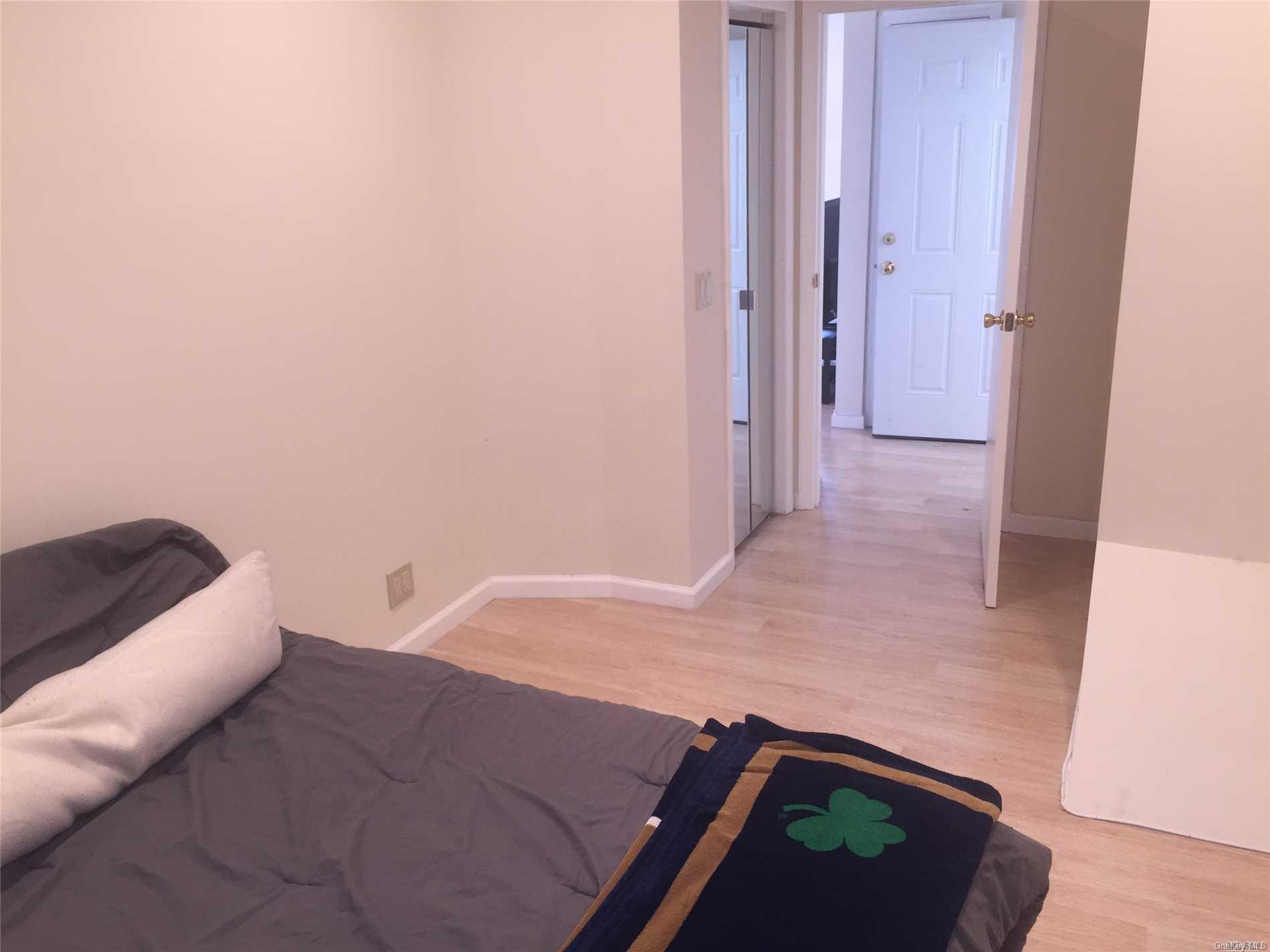 52-05 35th Street, Unit 2 Queens, NY 11101 - Photo 10 of 20 a bedroom with a bed