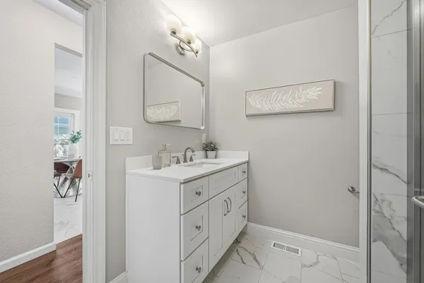 a bathroom with a sink and a mirror