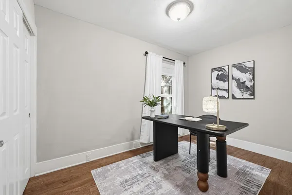 a view of a workspace with furniture