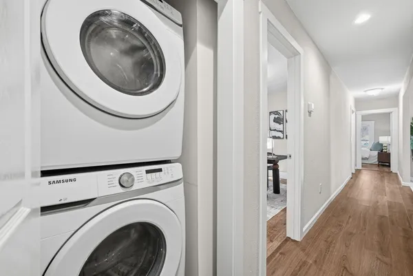 a view of a hallway with washer and dryer