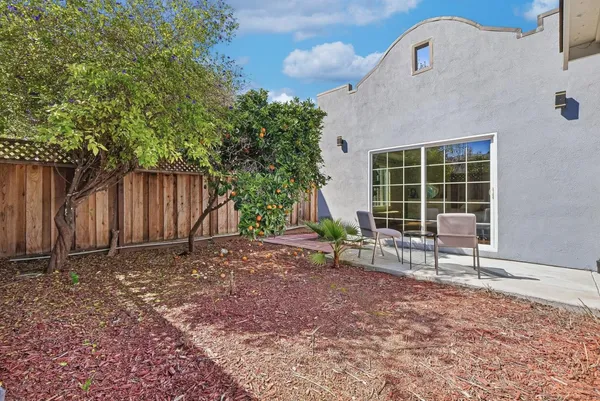 a backyard of a house with seating space