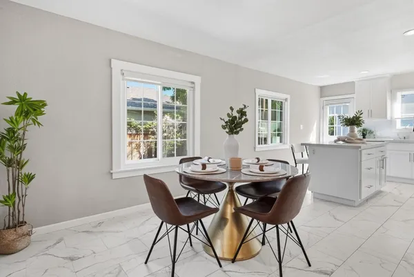a dining room with furniture and window