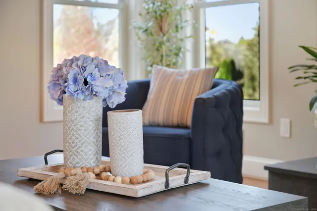a living room with furniture and a wooden floor