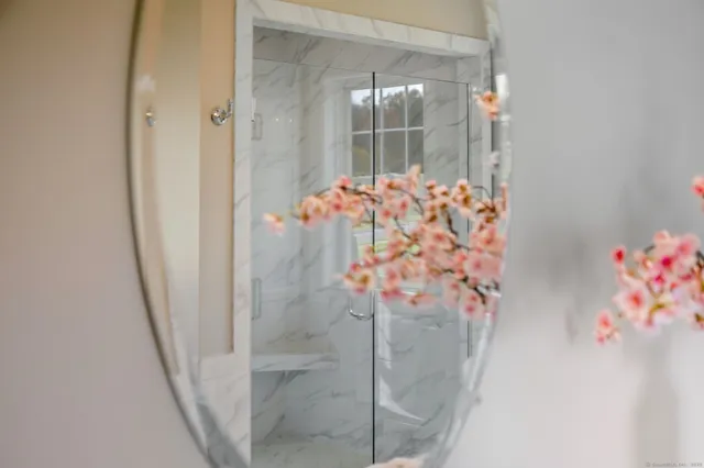 a bath tub sitting in a bathroom next to a window