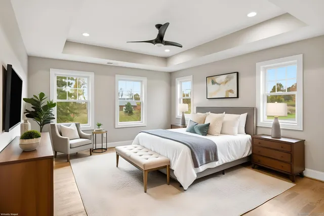 a bathroom with a double vanity sink mirror and a toilet