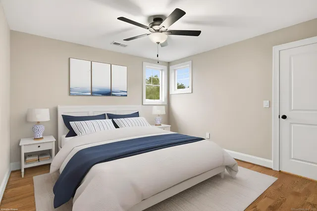 a bedroom with a large bed and a window