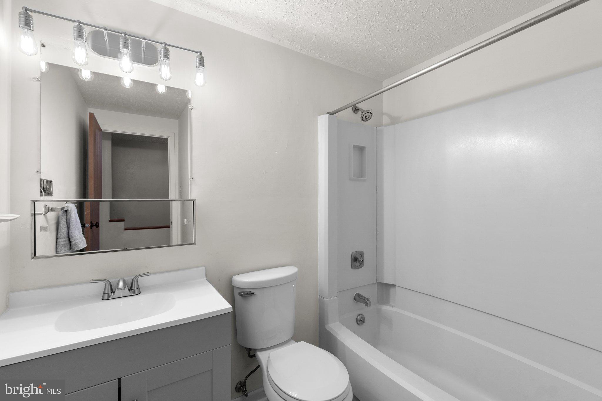 436 Heather Ridge Drive Frederick, MD 21702 - Photo 17 of 30 a bathroom with a sink toilet and shower