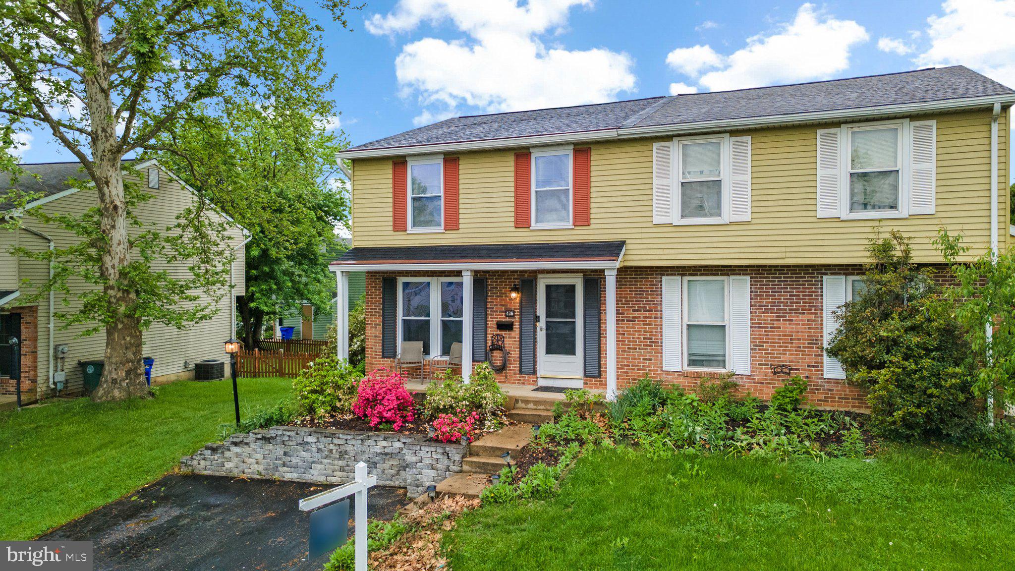 436 Heather Ridge Drive Frederick, MD 21702 - Photo 3 of 30 front view of a brick house with a yard