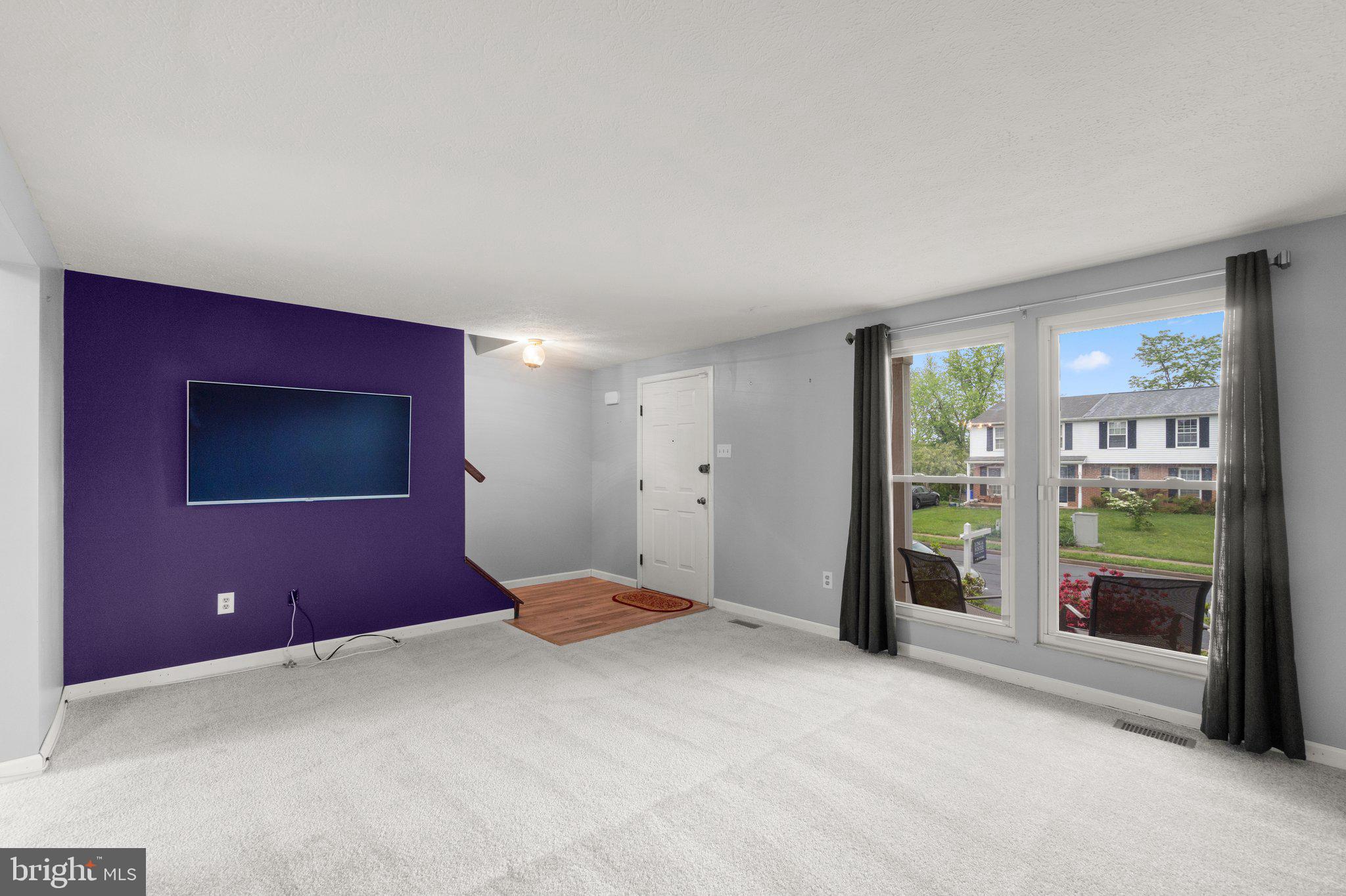 436 Heather Ridge Drive Frederick, MD 21702 - Photo 4 of 30 a view of an empty room with window and cabinet