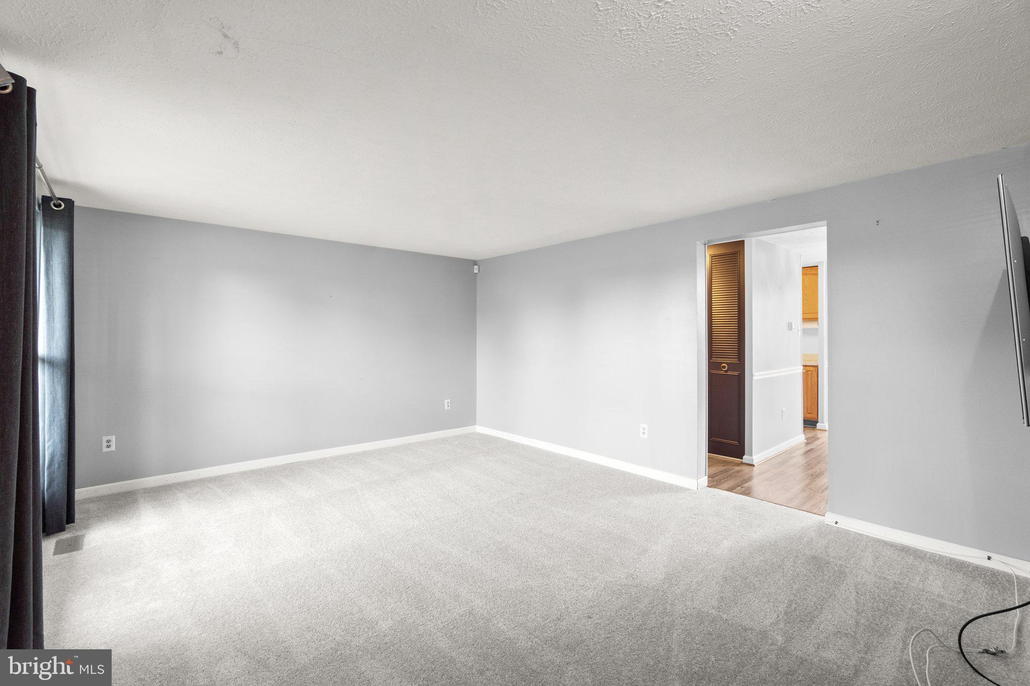 436 Heather Ridge Drive Frederick, MD 21702 - Photo 5 of 30 a view of an empty room and a window