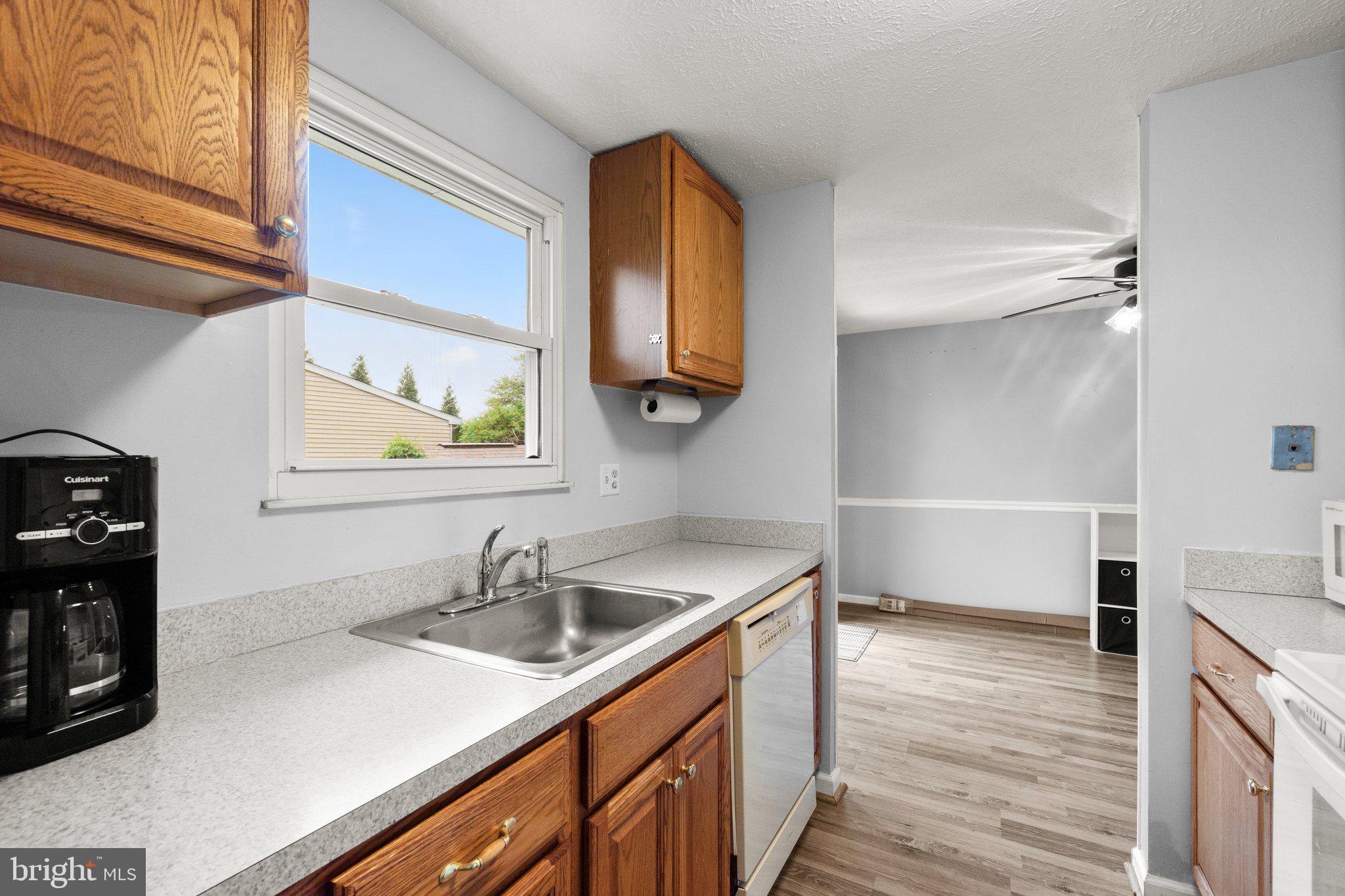 436 Heather Ridge Drive Frederick, MD 21702 - Photo 10 of 30 a kitchen with a sink and a refrigerator