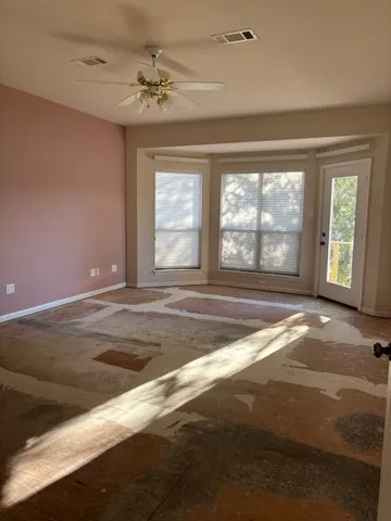 a view of an empty room with a window