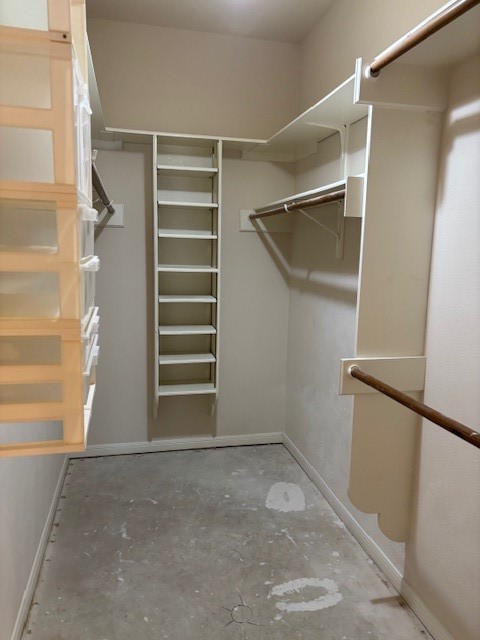 24 Lakeview Manor Huntsville, TX 77340 - Photo 19 of 26 a view of walk in closet with empty racks