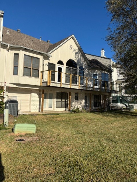 24 Lakeview Manor Huntsville, TX 77340 - Photo 2 of 26 a view of a big house with a big yard and large trees