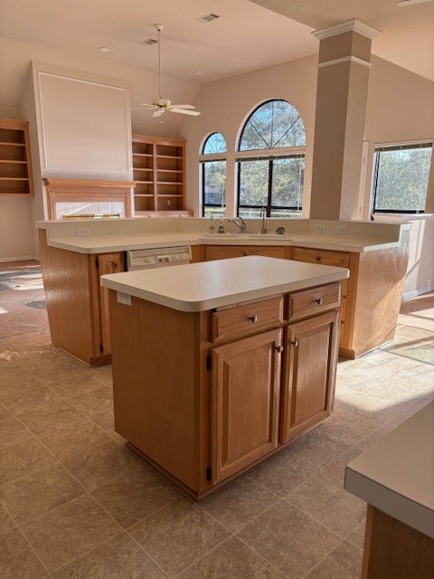 24 Lakeview Manor Huntsville, TX 77340 - Photo 9 of 26 a view of a kitchen with a sink a fireplace and a large window