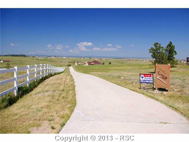 15028 Herring Road Colorado Springs, CO 80908 - Photo 16 of 17 All Concrete driveway to the home!
