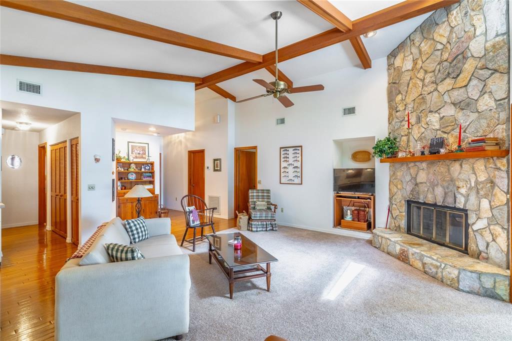 121 North Lake George Drive Georgetown, FL 32139 - Photo 13 of 46 a living room with furniture and a fireplace