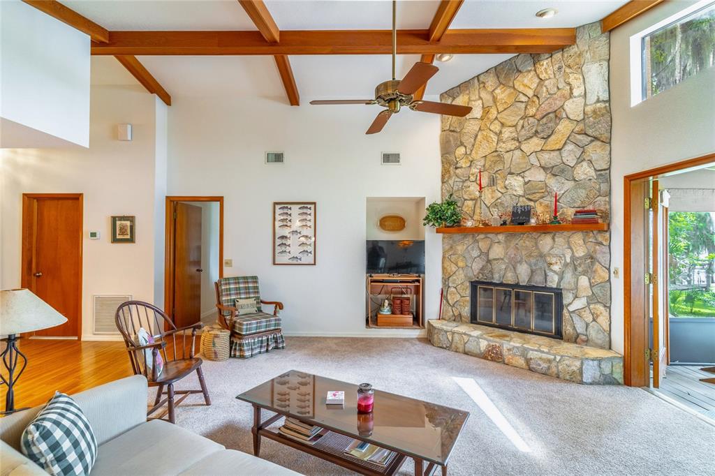 121 North Lake George Drive Georgetown, FL 32139 - Photo 14 of 46 a living room with furniture and a fireplace