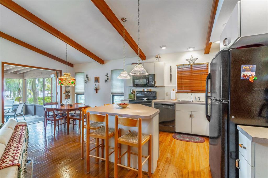 121 North Lake George Drive Georgetown, FL 32139 - Photo 16 of 46 a view of a dining room with furniture window and wooden floor