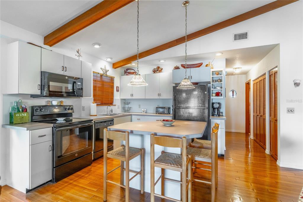 121 North Lake George Drive Georgetown, FL 32139 - Photo 18 of 46 a kitchen with stainless steel appliances granite countertop a sink a stove and a refrigerator