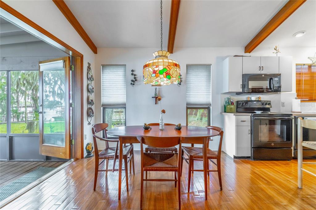 121 North Lake George Drive Georgetown, FL 32139 - Photo 19 of 46 a dining room with furniture a window and wooden floor